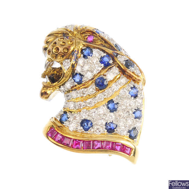 An 18ct gold diamond and gem-set leopard pendant.
