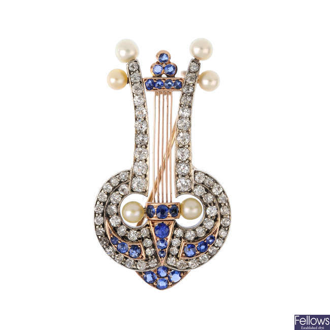 A late Victorian silver and gold, pearl, sapphire and diamond lyre brooch.