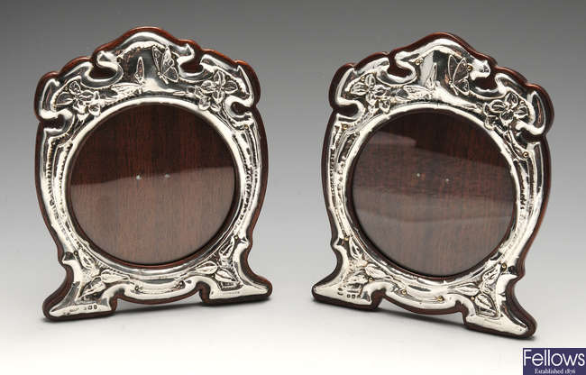 A pair of Art Nouveau silver mounted photograph frames.