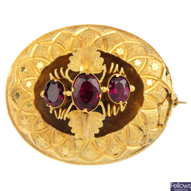A mid Victorian gold garnet brooch.