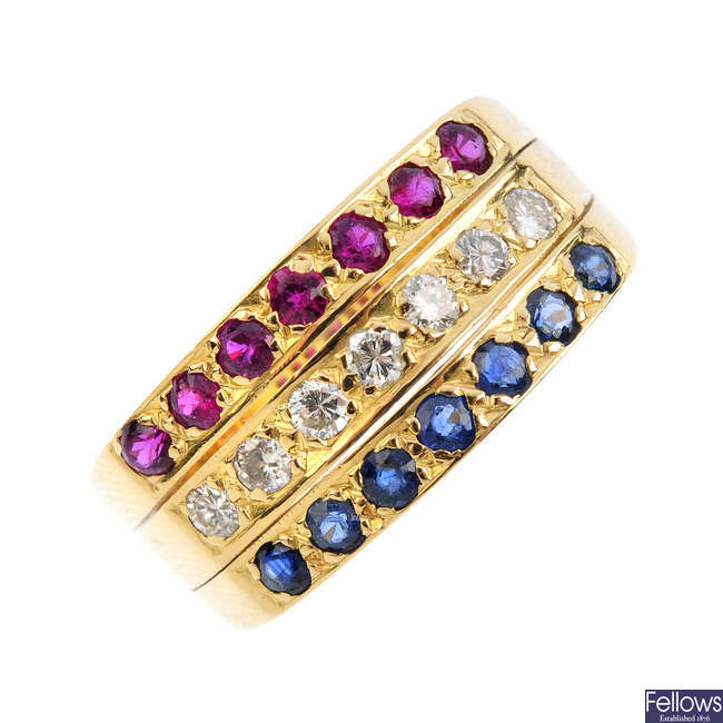 A ruby, sapphire and diamond three-row ring.