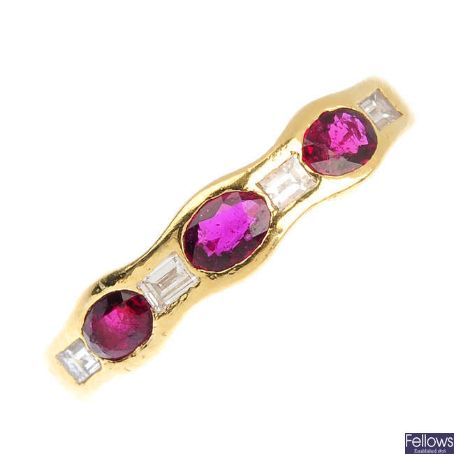 An 18ct gold synthetic ruby and diamond band ring.
