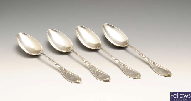 A set of four German silver table spoons in Art Nouveau style.