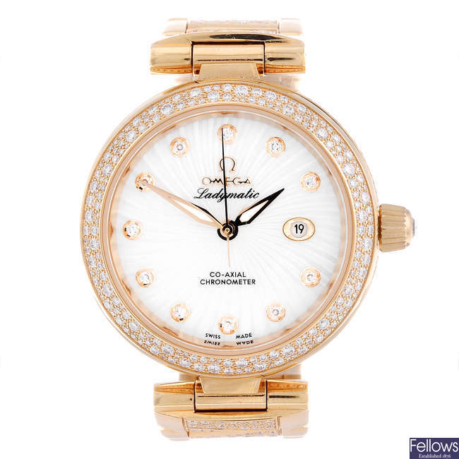 OMEGA - a lady's 18ct rose gold Ladymatic Co-Axial bracelet watch.