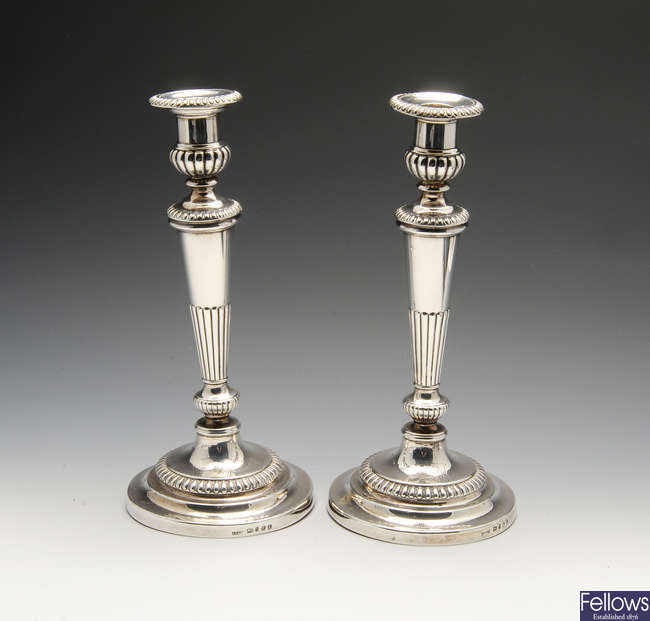 A pair of George III silver candlesticks.