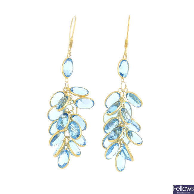 A pair of blue topaz earrings.