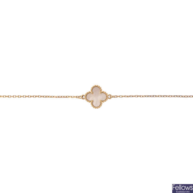 VAN CLEEF & ARPELS -  an 18ct gold 'Alhambra bracelet'.