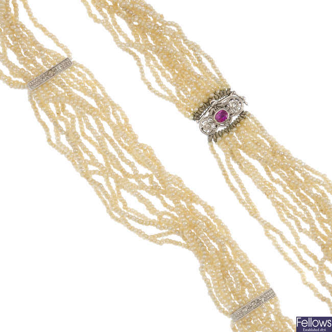 A seed pearl, ruby and diamond necklace.