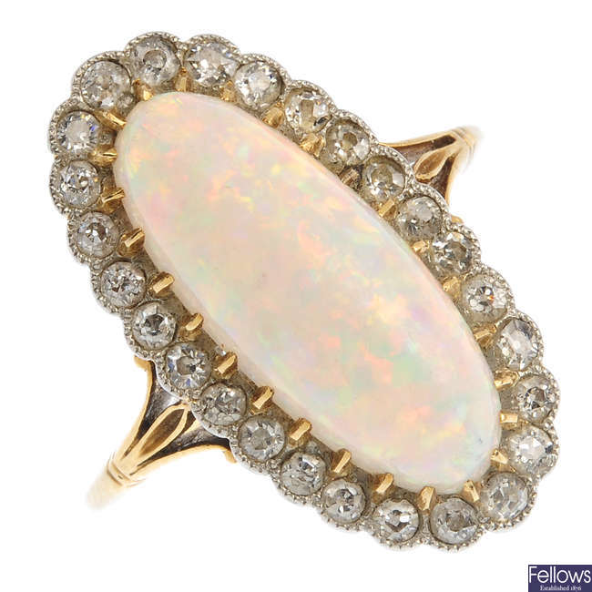 An early 20th century gold, opal and diamond cluster ring.