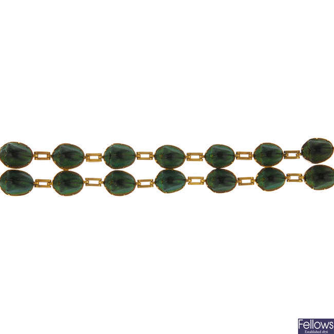 A late 19th century 15ct gold scarab bracelet.