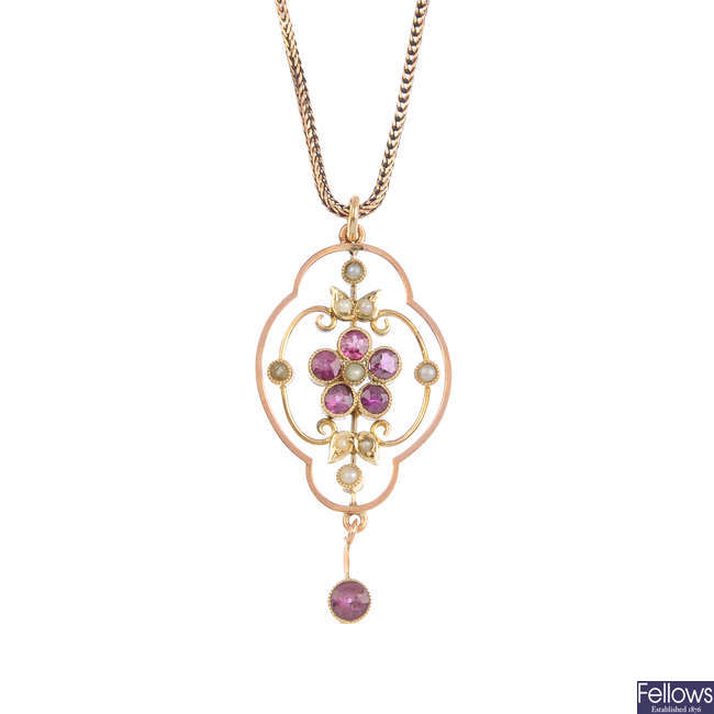 An early 20th century 9ct gold gold garnet and split-pearl pendant, with later chain.