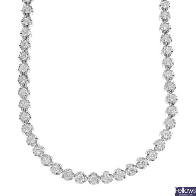 A diamond line necklace.