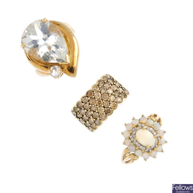 Three gem-set and diamond rings.