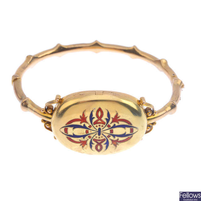 A late Victorian gold enamel locket bangle.