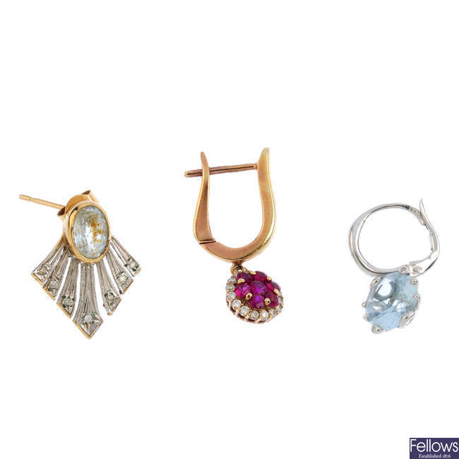 Three gem-set single earrings.