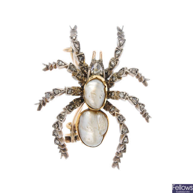 A late Victorian silver and gold, pearl and diamond spider brooch.