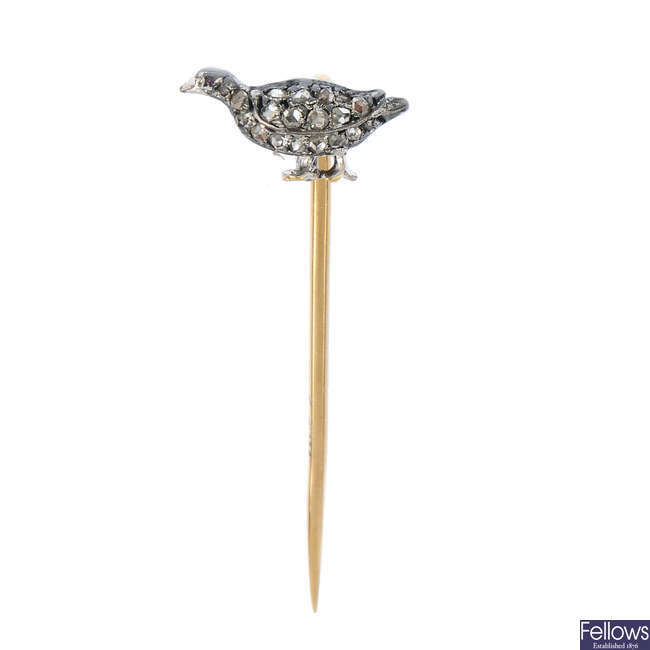 A diamond bird stickpin.