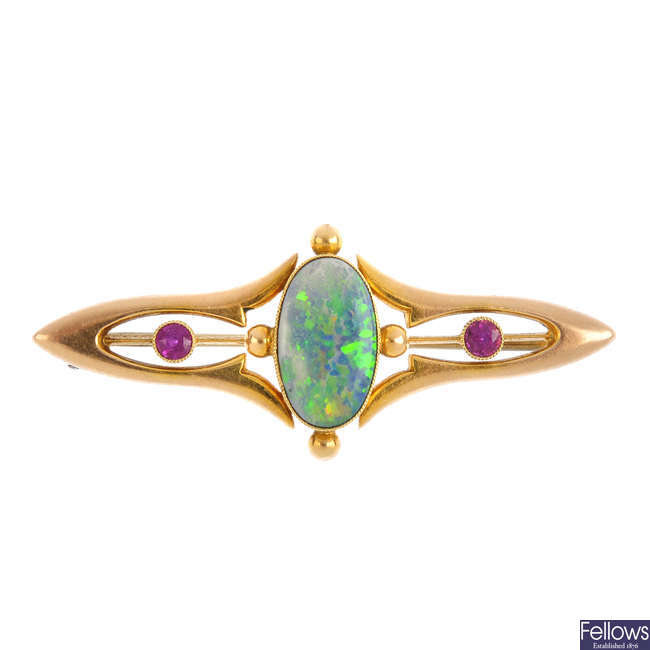 An Art Nouveau 15ct gold opal and synthetic ruby brooch.