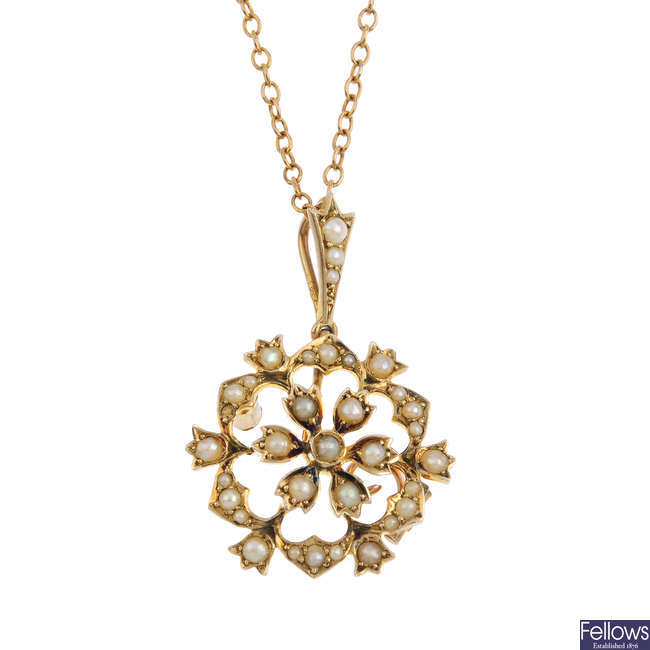A split pearl floral pendant, with chain.
