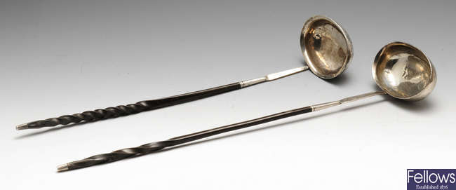 Two Georgian toddy ladles & a silver mounted spoon. (3).