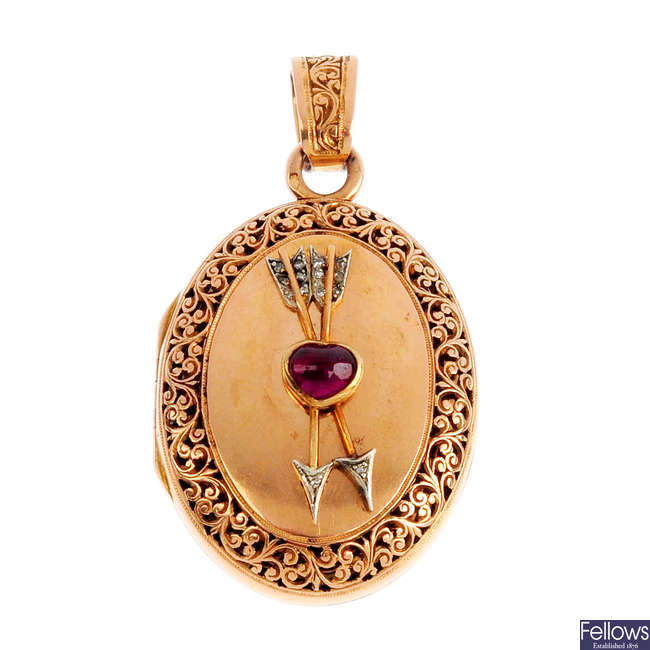 An early 20th century gold ruby and diamond locket.