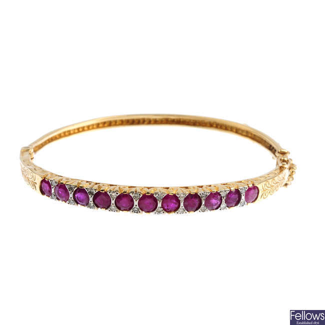 A glass-filled ruby and diamond hinged bangle.