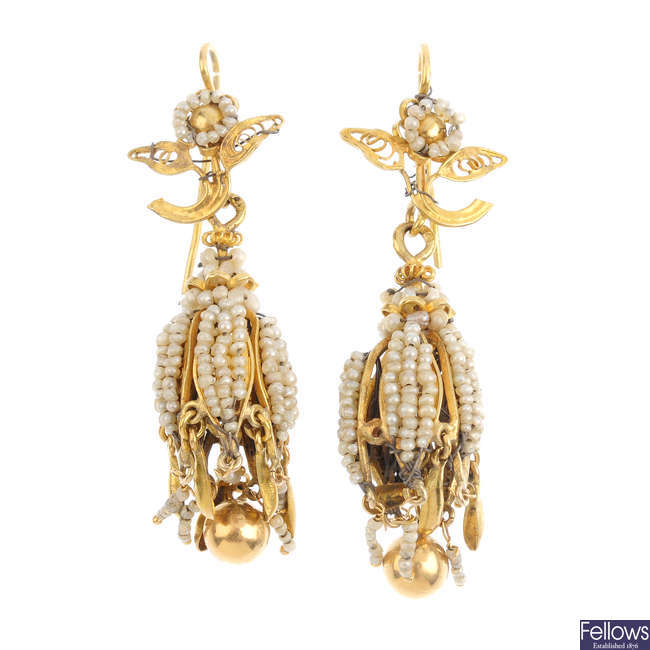 A pair of seed pearl earrings.