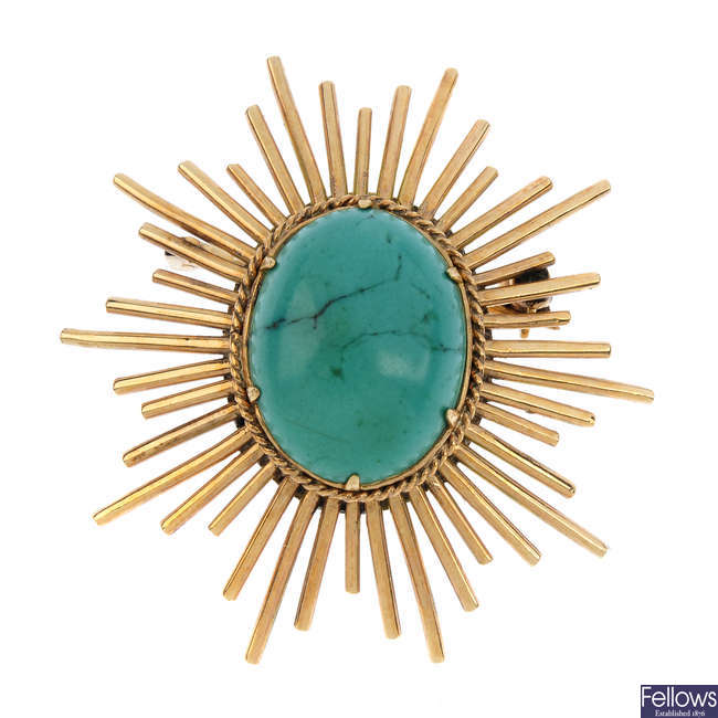 A turquoise brooch.