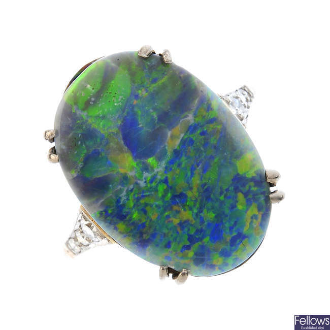A black opal and diamond ring.