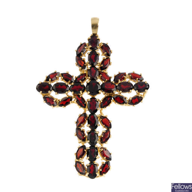 A garnet cross pendant.