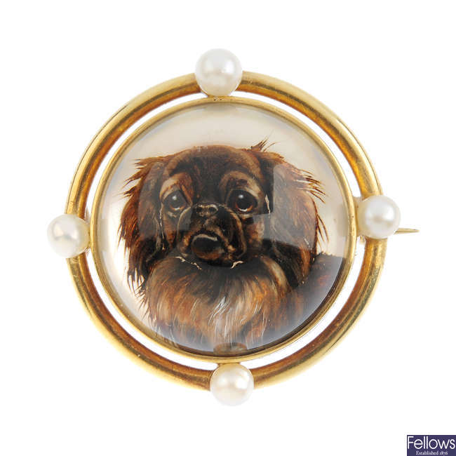 An early 20th century gold gem-set reverse-carved intaglio brooch.