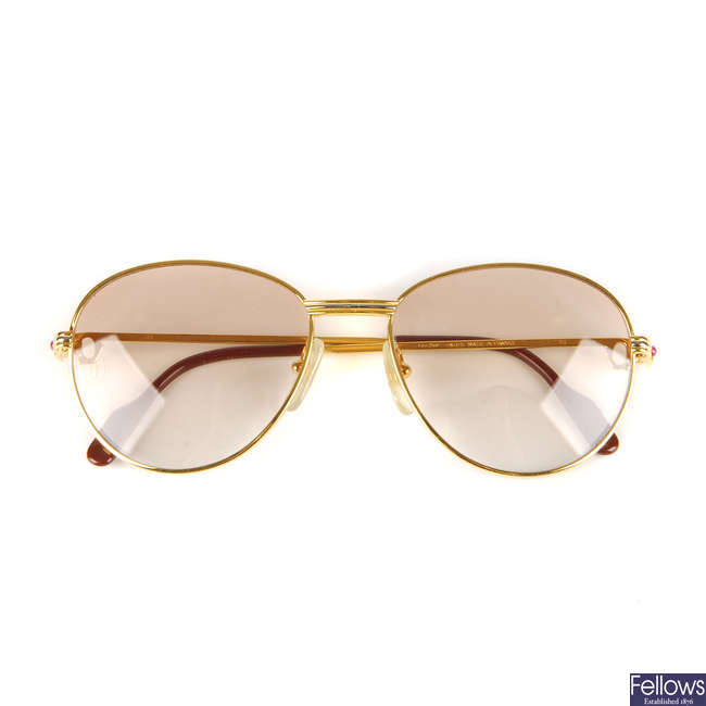CARTIER - a pair of rose tinted sunglasses.