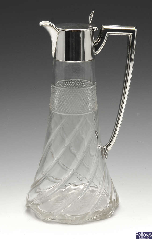 An early 20th century silver mounted glass claret jug by Walker & Hall.