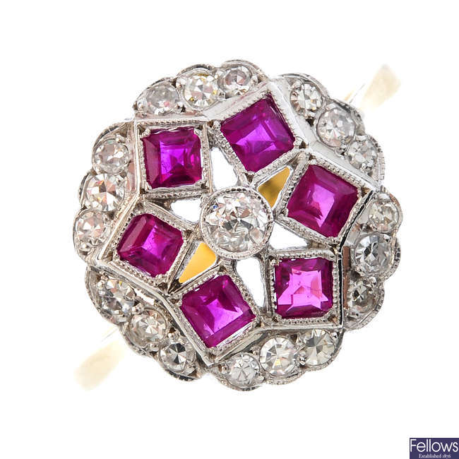 A diamond and ruby floral cluster ring.