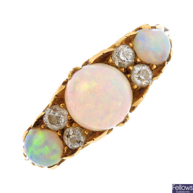 An early 20th century opal and diamond three-stone ring.