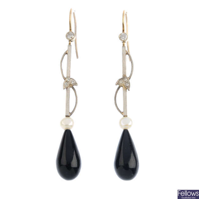 A pair of early 20th century onyx, diamond and seed pearl earrings.