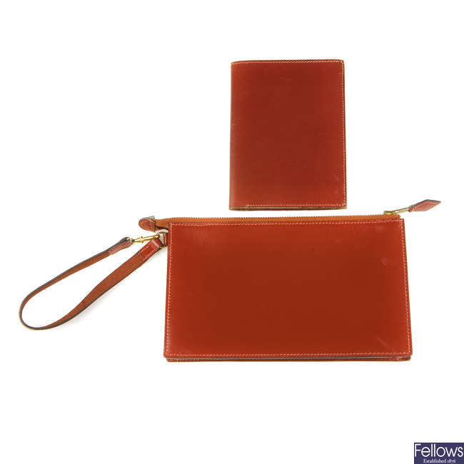 HERMÈS - a leather pouch and wallet.