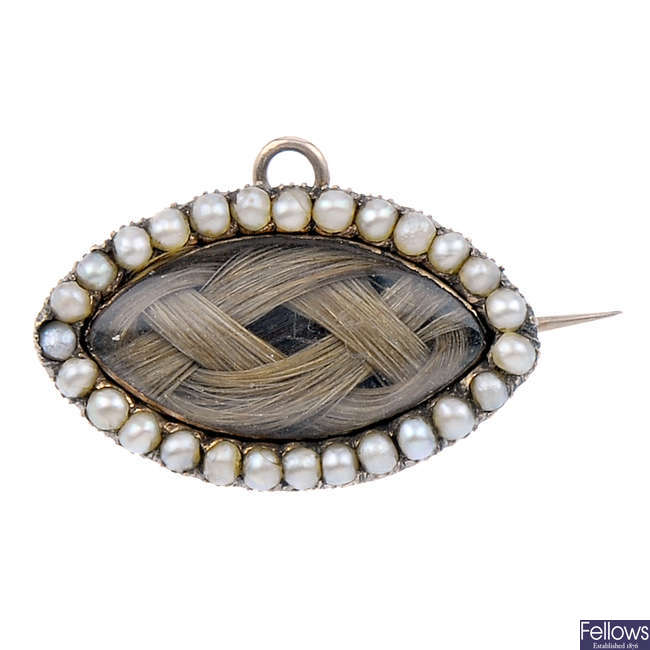 A mid Victorian split pearl memorial brooch.