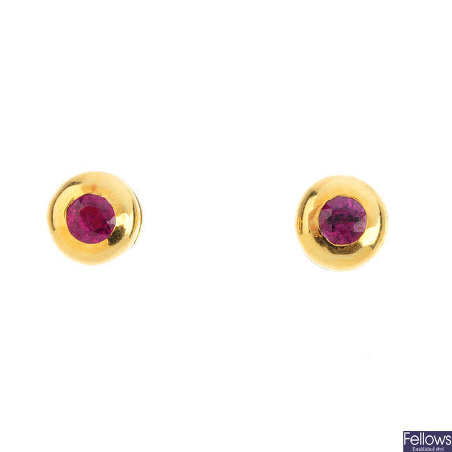 A pair of 18ct gold ruby stud earrings.