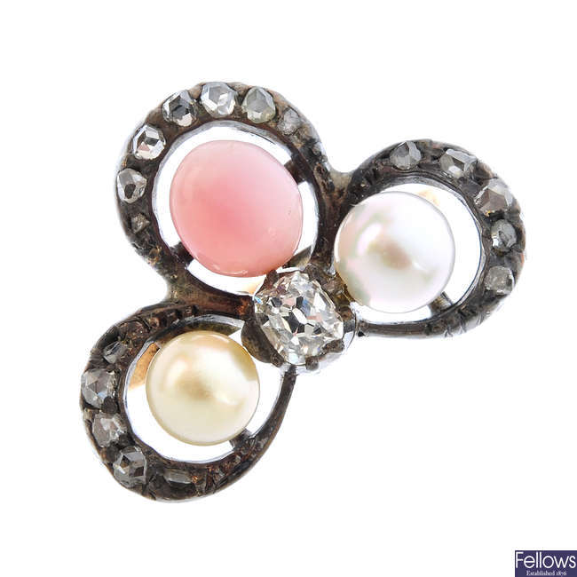 A diamond, conch pearl and cultured pearl shamrock ring.