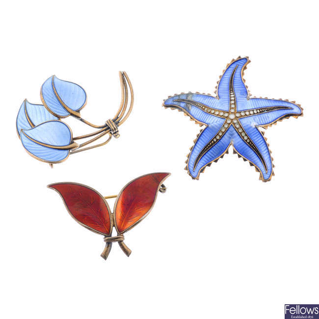 Two Scandinavian designer enamel brooches and three further enamel brooches.