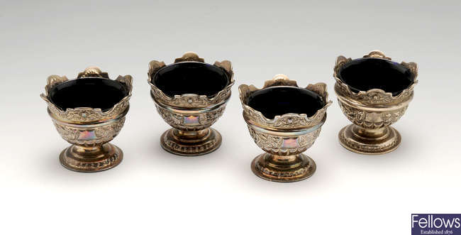 A set of four late Victorian silver open pedestal salts.