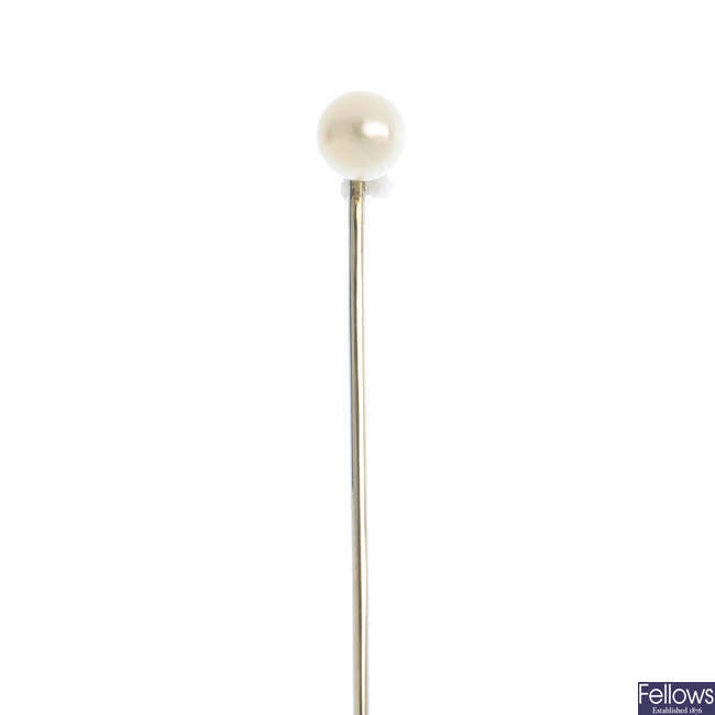 A natural pearl stickpin.