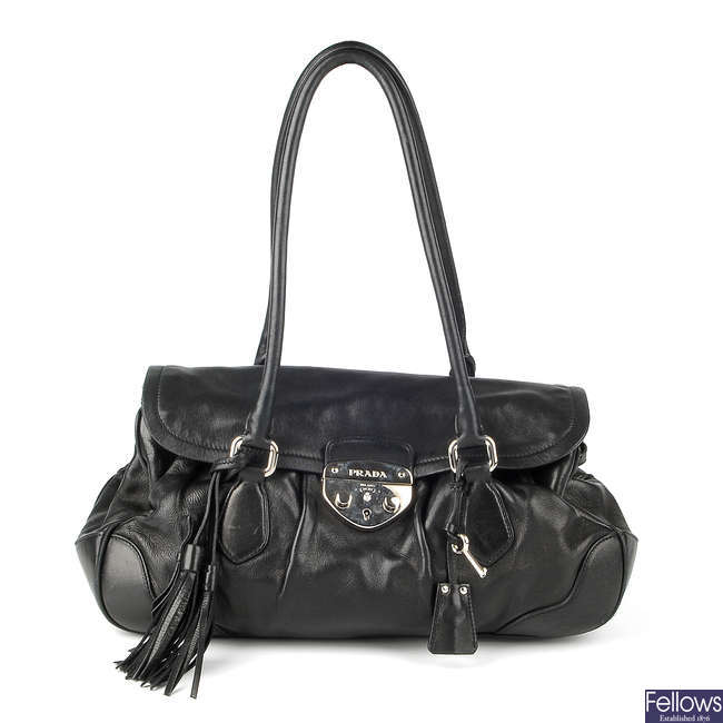 PRADA - a black leather Pushlock Tassel Flap handbag.