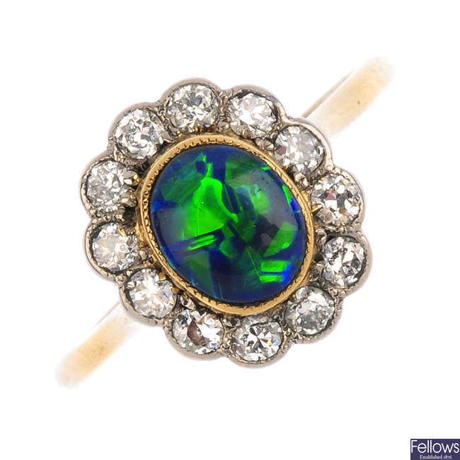 A black opal and diamond cluster ring.