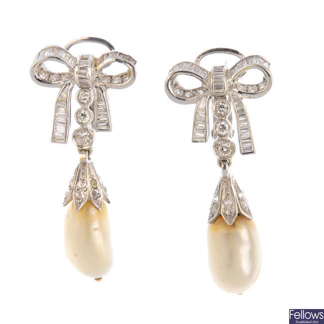 A pair of natural pearl and diamond earrings.