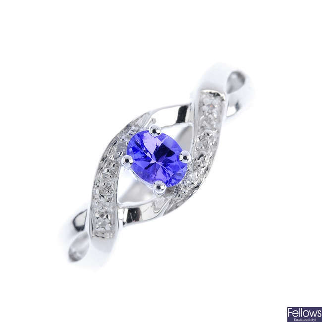A 9ct gold tanzanite and diamond crossover ring.