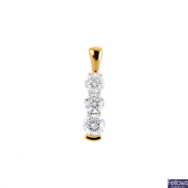 An 18ct gold diamond three-stone pendant.