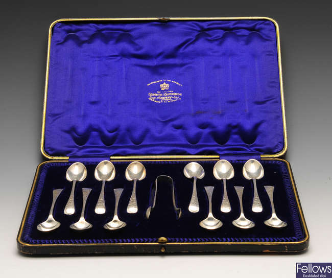 An Edwardian set of twelve silver teaspoons and a pair of sugar tongs & a cased set of six base metal reproduction Anointing spoons.