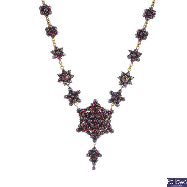 A late Victorian foil-backed garnet necklace.